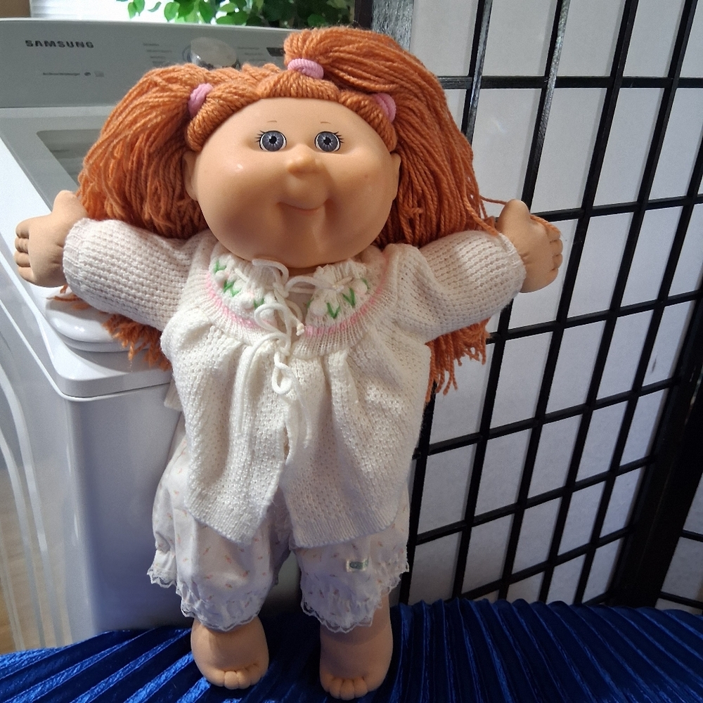 Charming Doll with Orange Hair and White Outfit